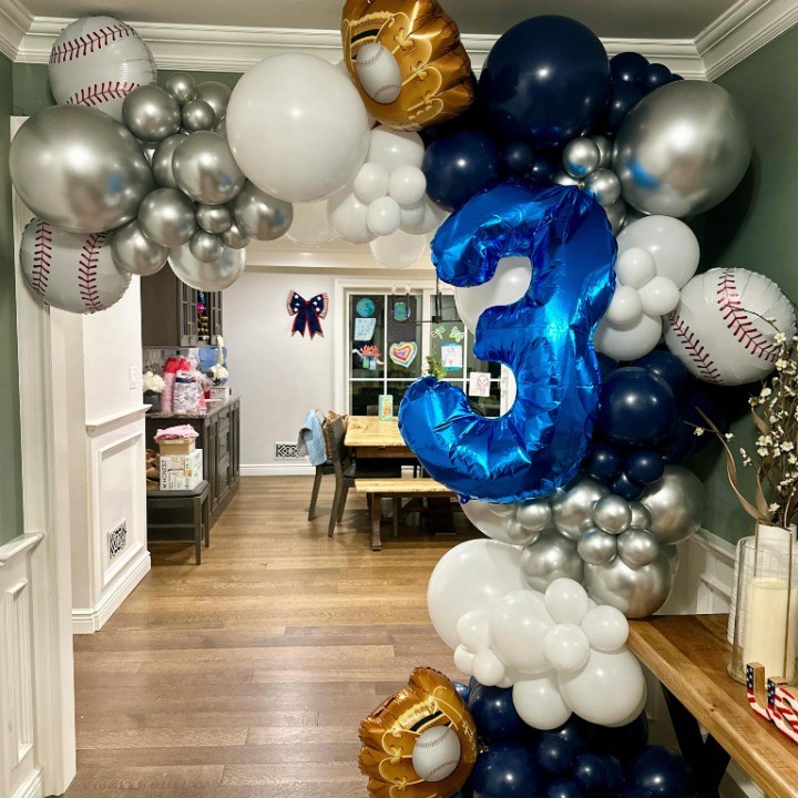 Baseball-themed number three balloon sculpture in navy and silver